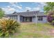 Charming backyard featuring a patio, mature landscaping, and an elegant pergola, ideal for outdoor living at 112 Boxwood Ln., Conway, SC 29526