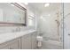 Beautiful bathroom with tiled shower, glass doors, new lighting, modern hardware, updated vanity with marble counter at 112 Boxwood Ln., Conway, SC 29526