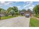 Charming brick home featuring an attached garage and long driveway at 112 Boxwood Ln., Conway, SC 29526