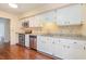 This eat-in kitchen offers stainless steel appliances, granite counters, white cabinets, and stone backsplash at 112 Boxwood Ln., Conway, SC 29526