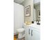 Bathroom with a toilet, vanity, and shower with a striped curtain at 1131 Camellia Dr., Surfside Beach, SC 29575
