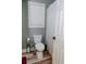 Bathroom featuring a toilet, window, and a shower with a white curtain at 1131 Camellia Dr., Surfside Beach, SC 29575