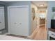 Bedroom with wood floors, a closet, and view of the hallway and kitchen at 1131 Camellia Dr., Surfside Beach, SC 29575