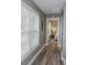 Hallway with wood floors, a window, and doorway leading to a bedroom at 1131 Camellia Dr., Surfside Beach, SC 29575
