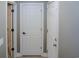 Hallway with multiple white doors and tiled floors at 1131 Camellia Dr., Surfside Beach, SC 29575