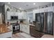 Modern kitchen with stainless steel appliances, granite countertops, and white cabinets at 1131 Camellia Dr., Surfside Beach, SC 29575