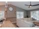 Comfortable living room with a large sofa, ceiling fan and wood accent wall at 1131 Camellia Dr., Surfside Beach, SC 29575