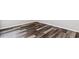An angled view showcasing the stylish, dark-toned wood flooring that adds a modern touch to the room at 116 Old Chimney Ln, Conway, SC 29526