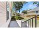 View of the backyard, with a privacy fence and mature trees at 119 Berry Tree Dr., Pawleys Island, SC 29585