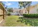 Private fenced backyard with mature landscaping and a well-maintained lawn at 119 Berry Tree Dr., Pawleys Island, SC 29585