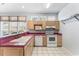 Sunlit kitchen features a window over the sink, and stainless steel appliances at 119 Berry Tree Dr., Pawleys Island, SC 29585