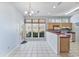 Kitchen area has lots of natural light, white tile floors, and stainless appliances at 119 Berry Tree Dr., Pawleys Island, SC 29585