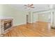 Inviting living space with hardwood floors, a brick fireplace, and an open layout at 119 Berry Tree Dr., Pawleys Island, SC 29585