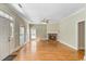 Bright living room with hardwood floors, a cozy fireplace, and abundant natural light at 119 Berry Tree Dr., Pawleys Island, SC 29585