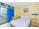 Relaxing queen-size bed near private balcony with an ocean view, creating a tranquil retreat at 1207 S Ocean Blvd. S # 50910, Myrtle Beach, SC 29577