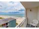 Relax and enjoy stunning ocean views from this condominium balcony with seating and bright skies at 1207 S Ocean Blvd. S # 50910, Myrtle Beach, SC 29577