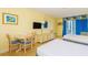 This room has 2 queen beds, a TV, a balcony with a beautiful view, a dresser and a table for dining at 1207 S Ocean Blvd. S # 50910, Myrtle Beach, SC 29577