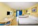 Bright room featuring two cozy queen beds, dining table, and a private balcony with relaxing furniture at 1207 S Ocean Blvd. S # 50910, Myrtle Beach, SC 29577