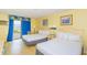 A bright bedroom with 2 queen beds provides a relaxing retreat with a view to the balcony with ocean view at 1207 S Ocean Blvd. S # 50910, Myrtle Beach, SC 29577