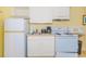 This spacious kitchenette has a fridge, a stove, a microwave, a sink, and plenty of counter space at 1207 S Ocean Blvd. S # 50910, Myrtle Beach, SC 29577