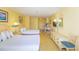 Studio apartment featuring two beds, a kitchenette, a dining area, and ample storage space at 1207 S Ocean Blvd. S # 50910, Myrtle Beach, SC 29577