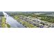 Aerial view of a waterfront community, showcasing homes with boat docks and backyard pools at 136 Queens Cove Place # B, Myrtle Beach, SC 29579