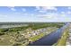 Aerial view of a waterfront community featuring lake access, boat docks, and beautiful single Gathering homes at 136 Queens Cove Place # B, Myrtle Beach, SC 29579