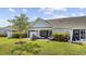 Backyard featuring a patio with seating, trimmed hedges, and a tree at 136 Queens Cove Place # B, Myrtle Beach, SC 29579