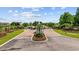 Elegant gated entrance welcomes residents with manicured landscaping and a secure community ambiance at 136 Queens Cove Place # B, Myrtle Beach, SC 29579