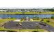 Aerial view showcases a waterfront gazebo alongside parking and boat docks for convenient access at 136 Queens Cove Place # B, Myrtle Beach, SC 29579