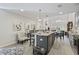 Open kitchen featuring an island with seating, stainless steel appliances, and ample counter space at 136 Queens Cove Place # B, Myrtle Beach, SC 29579
