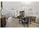Spacious living room with vaulted ceilings, flowing into the dining area, creating an inviting space at 136 Queens Cove Place # B, Myrtle Beach, SC 29579