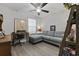 Office space showcasing a gray couch, desk with a laptop, and laminate wood-look flooring at 136 Queens Cove Place # B, Myrtle Beach, SC 29579
