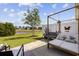 Relaxing patio featuring a pergola, cushioned seating, and a view of the pond at 136 Queens Cove Place # B, Myrtle Beach, SC 29579