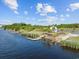 An aerial view of a gazebo, waterway, and docks with lush landscaping and convenient access at 136 Queens Cove Place # B, Myrtle Beach, SC 29579