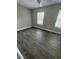 This bedroom features wood-look flooring and two windows at 1432 Highway 544 # F1, Conway, SC 29526