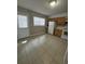 Functional kitchen featuring classic cabinetry, white appliances, and tile flooring at 1432 Highway 544 # F1, Conway, SC 29526