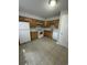 Well-lit kitchen featuring essential appliances, tile flooring, and ample cabinet space at 1432 Highway 544 # F1, Conway, SC 29526