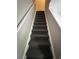 A carpeted stairway leads upstairs in the home at 1432 Highway 544 # F1, Conway, SC 29526