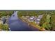 Aerial view showcasing a condo community next to the waterway and surrounding nature at 1514 Lanterns Rest Rd. # 304, Myrtle Beach, SC 29579