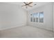 Bright bedroom with a large window, neutral carpet, a ceiling fan, and ample natural light at 1514 Lanterns Rest Rd. # 304, Myrtle Beach, SC 29579