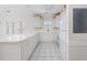 Bright kitchen with white cabinets, tile floors, and large island at 1514 Lanterns Rest Rd. # 304, Myrtle Beach, SC 29579