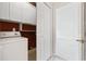 Interior utility room with a closet and a washing machine beside an open doorway at 1514 Lanterns Rest Rd. # 304, Myrtle Beach, SC 29579