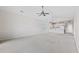 Spacious living room featuring neutral carpet, vaulted ceilings and a view into the kitchen at 1514 Lanterns Rest Rd. # 304, Myrtle Beach, SC 29579