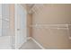 Bright walk-in closet with white wire shelving and a convenient storage unit at 1514 Lanterns Rest Rd. # 304, Myrtle Beach, SC 29579