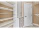Walk-in closet featuring custom built-in shelving and storage spaces at 1514 Lanterns Rest Rd. # 304, Myrtle Beach, SC 29579