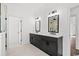Bright bathroom with dual vanities, framed mirrors, and modern black fixtures at 163 Sago Palm Dr., Myrtle Beach, SC 29579