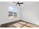 Light-filled bedroom with hardwood floors and a large arched window at 163 Sago Palm Dr., Myrtle Beach, SC 29579