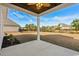 The covered patio offers an enjoyable outdoor space with a ceiling fan and view of the backyard at 163 Sago Palm Dr., Myrtle Beach, SC 29579