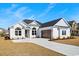 Charming single-story home with a two-car garage and well manicured landscaping at 163 Sago Palm Dr., Myrtle Beach, SC 29579